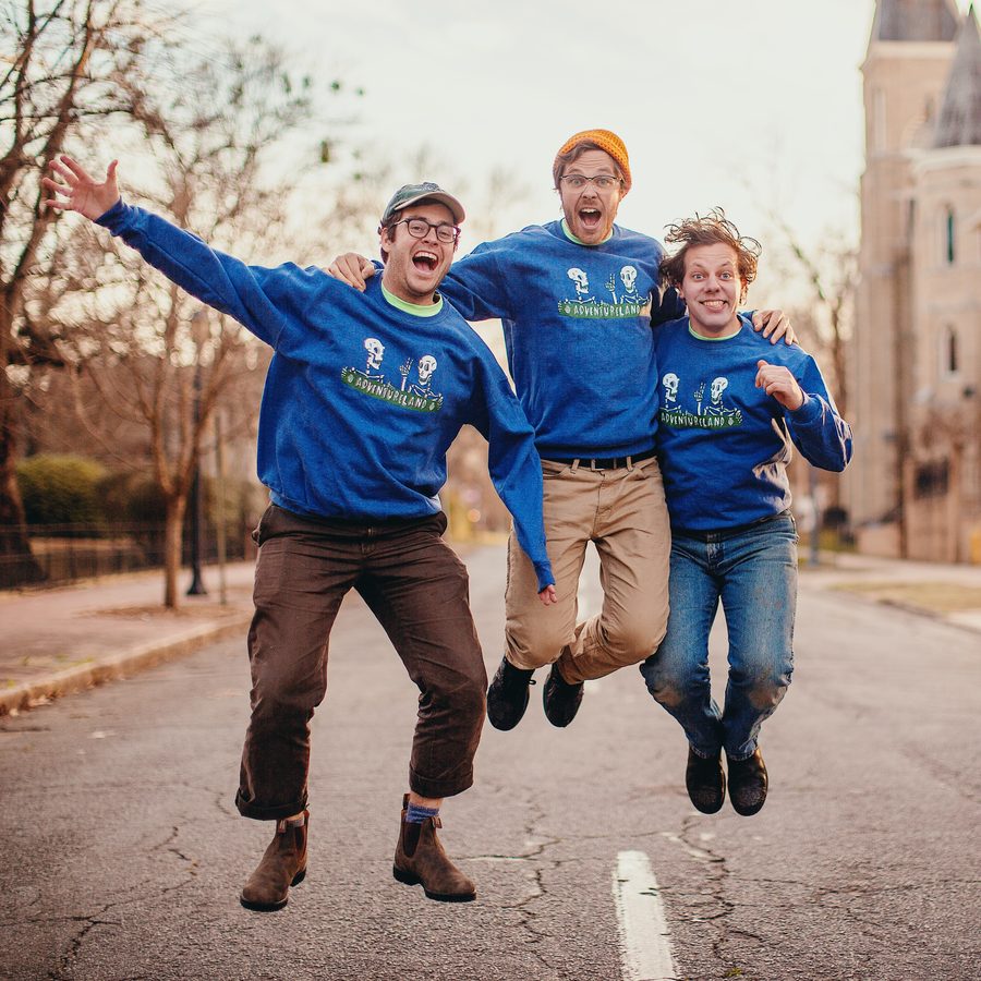 Adventureland jumping in matching band sweatshirts